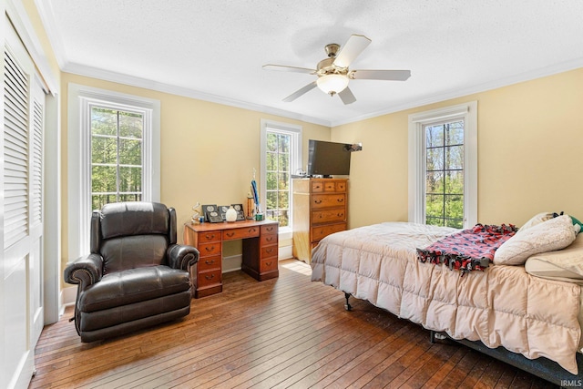 14612 Liberty Mills Rd, Fort Wayne, IN 46814 - bedroom featuring hardwood / wood-style floors, crown molding, multiple windows, ceiling fan, and a closet