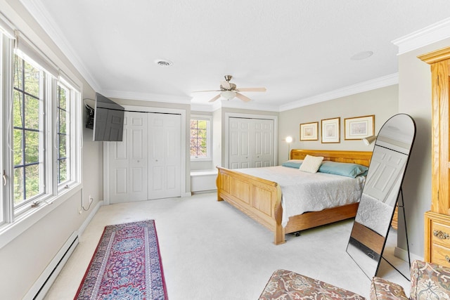 14612 Liberty Mills Rd, Fort Wayne, IN 46814 - bedroom featuring baseboard heating, two closets, ornamental molding, light carpet, and ceiling fan