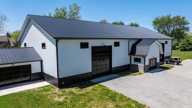 14612 Liberty Mills Rd, Fort Wayne, IN 46814 - view of front of home with a garage, an outdoor structure, and metal roof