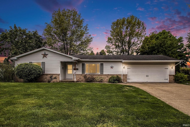 1612 W Grant St, Bremen, IN 46506 - ranch-style house featuring brick siding, a garage, driveway, and a lawn