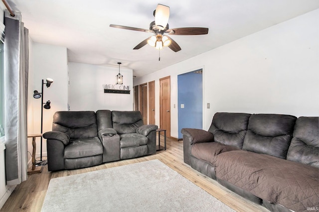 1612 W Grant St, Bremen, IN 46506 - living area with ceiling fan and light wood finished floors