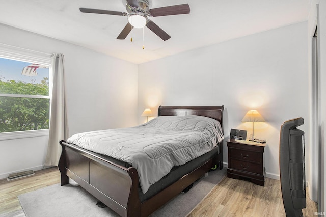 1612 W Grant St, Bremen, IN 46506 - bedroom featuring light wood finished floors, baseboards, and ceiling fan