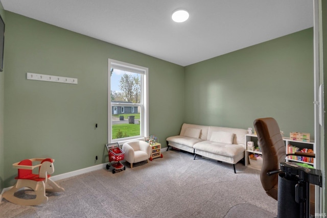 rec room featuring carpet and baseboards