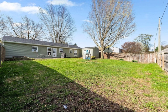 view of yard with an outdoor structure and a shed