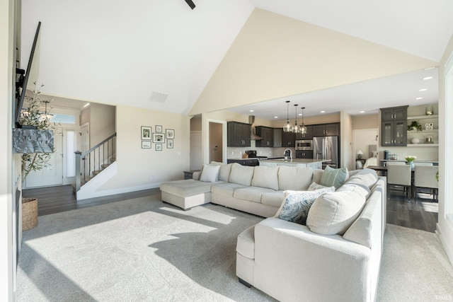 111 Big Rock Pass, Huntertown, IN 46748 - living area with high vaulted ceiling, stairway, recessed lighting, a chandelier, and carpet