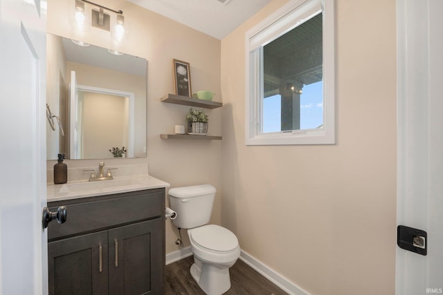 111 Big Rock Pass, Huntertown, IN 46748 - bathroom with toilet, wood finished floors, baseboards, and vanity