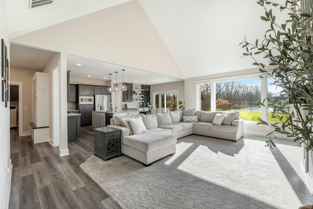 111 Big Rock Pass, Huntertown, IN 46748 - living area featuring dark wood-style flooring, a high ceiling, recessed lighting, a chandelier, and baseboards
