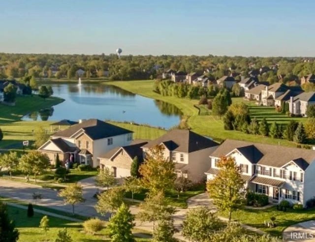 aerial perspective of suburban area featuring a nearby body of water