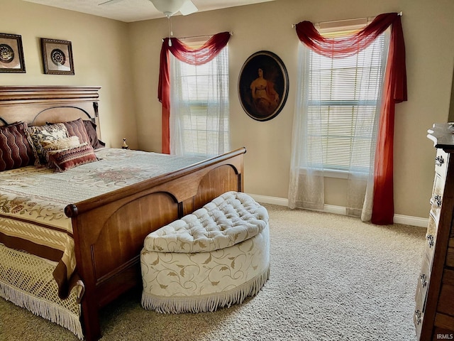 bedroom featuring carpet floors and baseboards