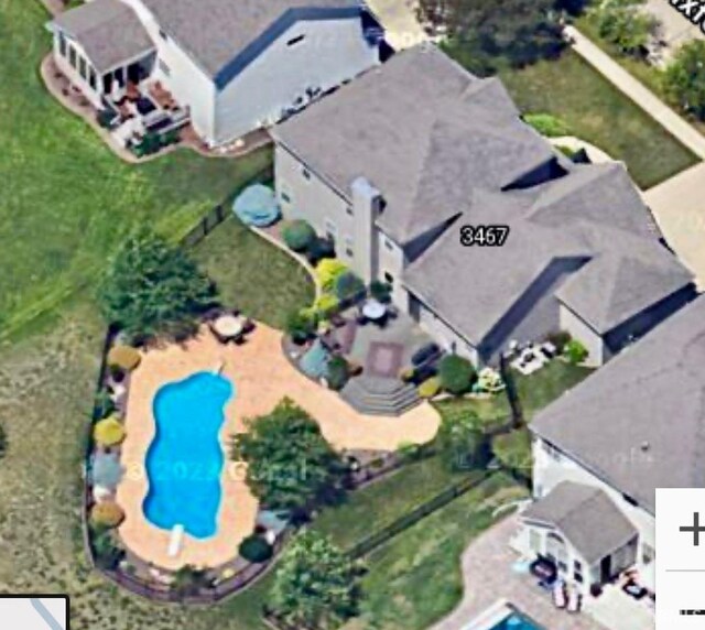 view of property location with a pool
