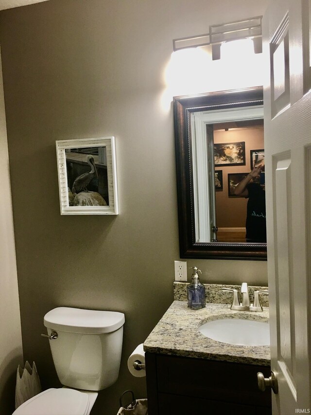 half bath with toilet and vanity