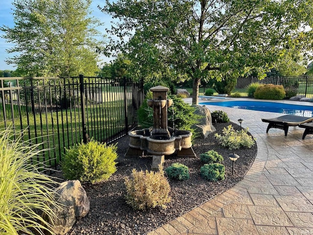 view of pool with fence and a patio