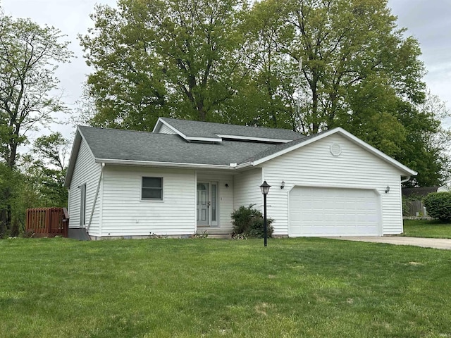 ranch-style home featuring a garage, concrete driveway, roof with shingles, and a front yard