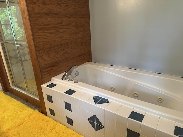 full bath with a whirlpool tub and a shower stall