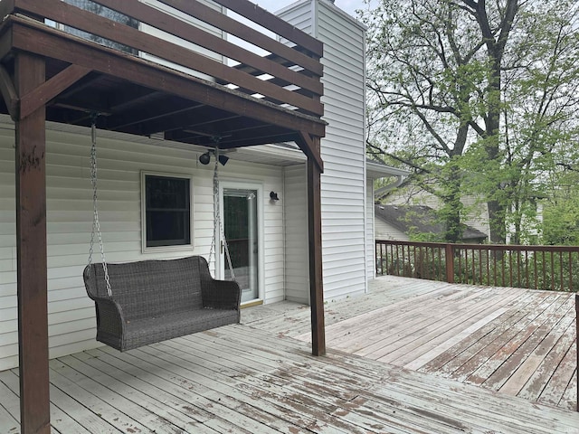 wooden deck with a ceiling fan