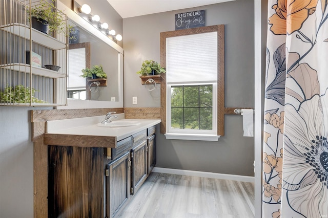 116 El Dorado Trl W, Fort Wayne, IN 46825 - full bathroom with vanity, wood finished floors, and baseboards