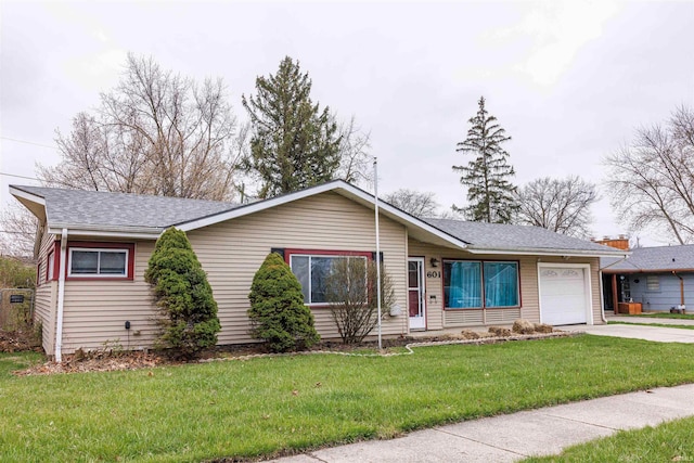 ranch-style house featuring a garage, driveway, a front lawn, and roof with shingles