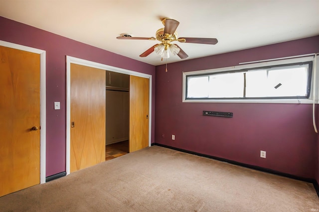 unfurnished bedroom featuring a closet, carpet floors, a ceiling fan, and baseboards