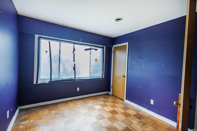 empty room with baseboards