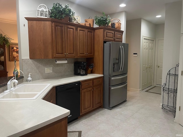 12116 Autumn Breeze Dr, Fort Wayne, IN 46845 - kitchen featuring stainless steel fridge, black dishwasher, a sink, tasteful backsplash, and light countertops