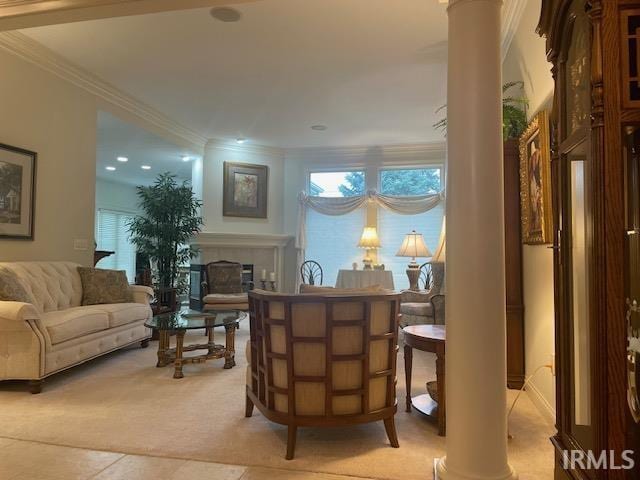 12116 Autumn Breeze Dr, Fort Wayne, IN 46845 - living area with ornamental molding, ornate columns, a fireplace, light colored carpet, and light tile patterned flooring
