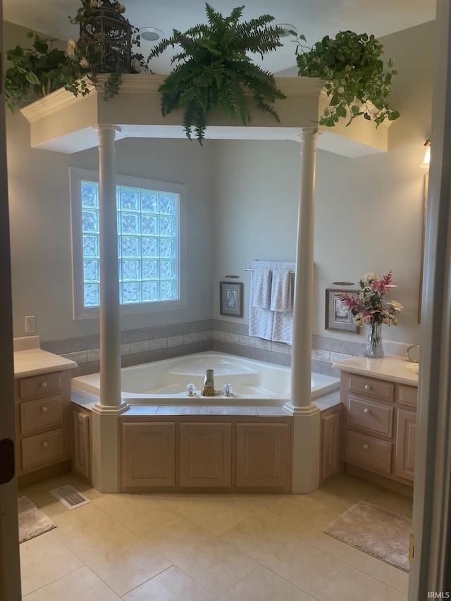 12116 Autumn Breeze Dr, Fort Wayne, IN 46845 - bathroom with ornate columns, a garden tub, and tile patterned floors