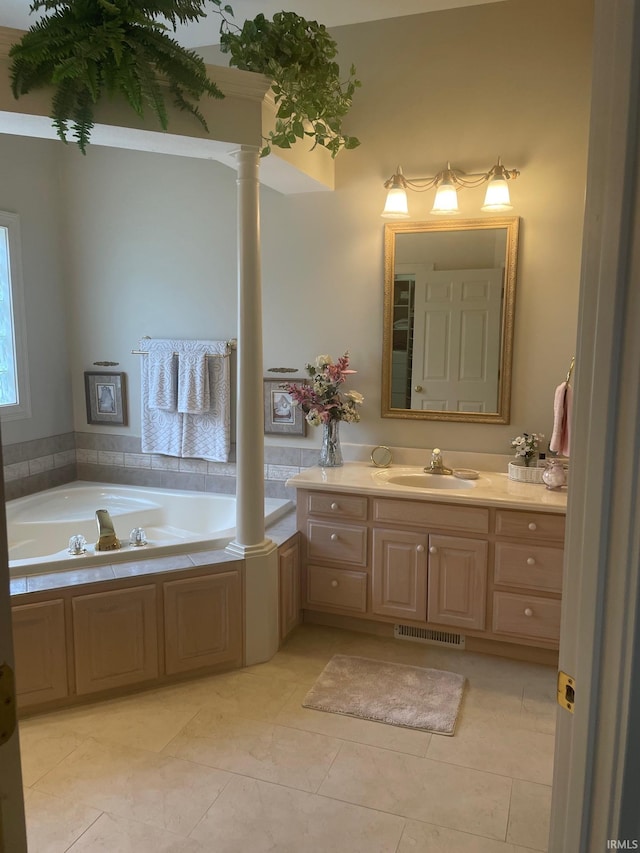 12116 Autumn Breeze Dr, Fort Wayne, IN 46845 - bathroom featuring ornate columns, vanity, a bath, and tile patterned floors