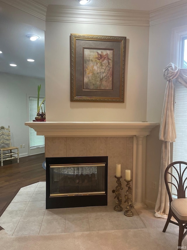 12116 Autumn Breeze Dr, Fort Wayne, IN 46845 - detailed view of a tile fireplace, crown molding, recessed lighting, and baseboards