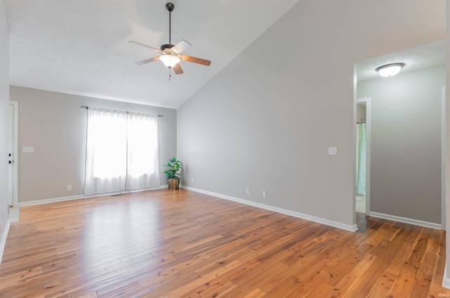 11430 Kestrel Ct, Evansville, IN 47725 - spare room with a ceiling fan, light wood finished floors, baseboards, and high vaulted ceiling