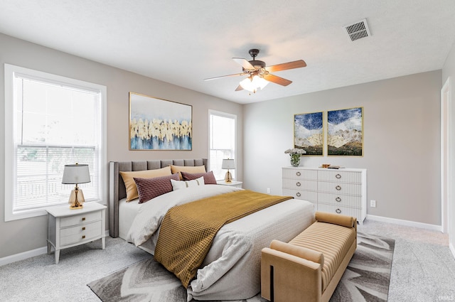 11430 Kestrel Ct, Evansville, IN 47725 - bedroom with light colored carpet, multiple windows, baseboards, and ceiling fan