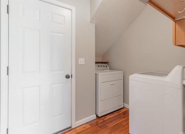 11430 Kestrel Ct, Evansville, IN 47725 - clothes washing area with independent washer and dryer, light wood-type flooring, and baseboards