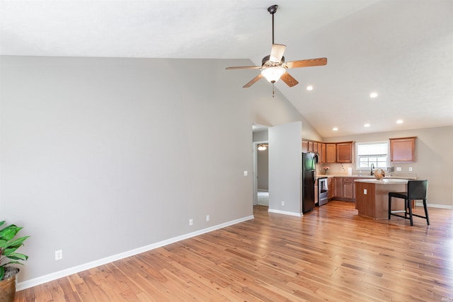11430 Kestrel Ct, Evansville, IN 47725 - living room featuring recessed lighting, a ceiling fan, baseboards, light wood-style floors, and high vaulted ceiling