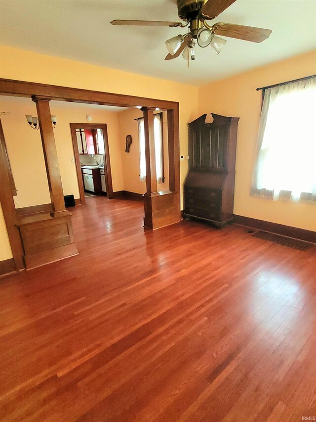 625 S 29th St, Lafayette, IN 47904 - unfurnished living room with wood finished floors, a ceiling fan, a sink, and baseboards