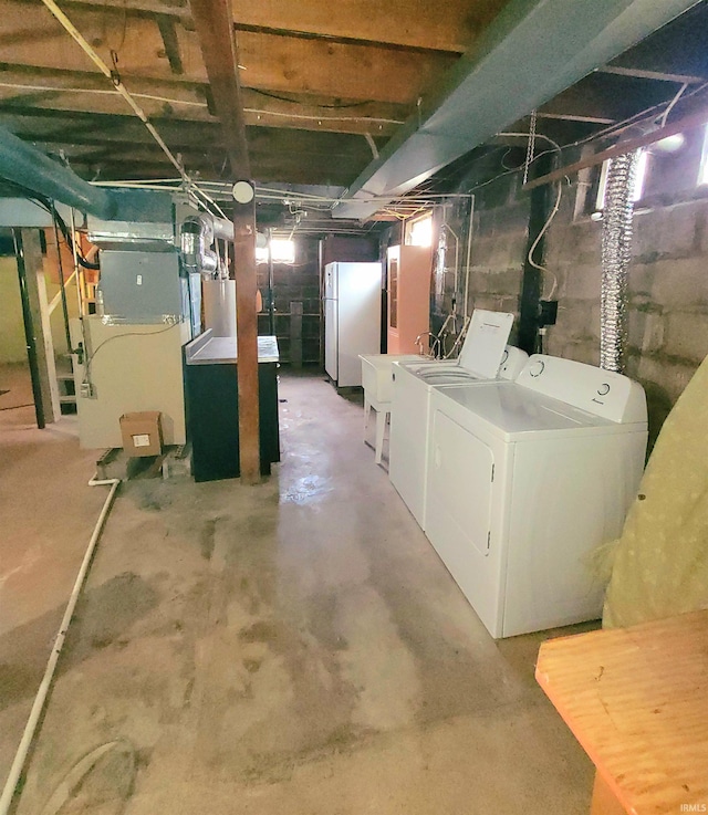 625 S 29th St, Lafayette, IN 47904 - below grade area with freestanding refrigerator, washer and dryer, heating unit, and a sink