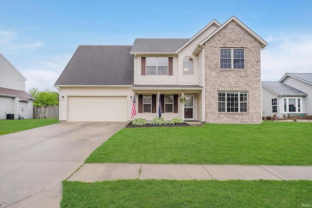 2507 Audri Ln, Kokomo, IN 46901 - traditional-style house with concrete driveway, an attached garage, cooling unit, and brick siding