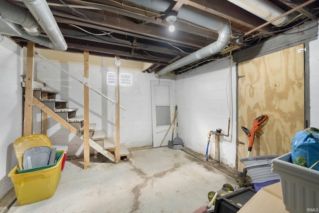 unfinished basement with stairway