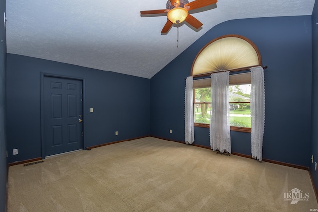 4105 W Friar Dr, Muncie, IN 47304 - spare room featuring vaulted ceiling, carpet floors, ceiling fan, and baseboards