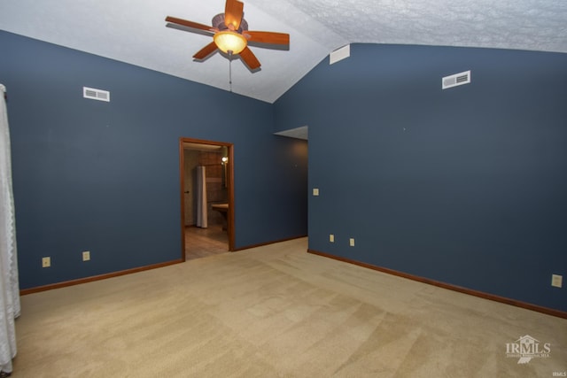 4105 W Friar Dr, Muncie, IN 47304 - carpeted spare room with vaulted ceiling, a ceiling fan, and baseboards