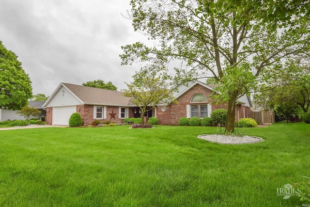 4105 W Friar Dr, Muncie, IN 47304 - ranch-style house featuring brick siding, a garage, and driveway