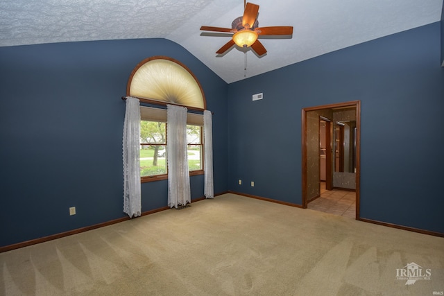 4105 W Friar Dr, Muncie, IN 47304 - empty room featuring vaulted ceiling, a ceiling fan, carpet floors, and baseboards