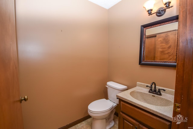 4105 W Friar Dr, Muncie, IN 47304 - bathroom with toilet, vanity, and baseboards