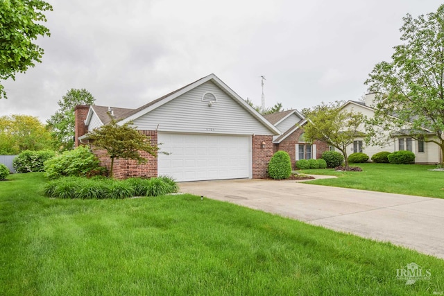 4105 W Friar Dr, Muncie, IN 47304 - view of front of home with brick siding, an attached garage, driveway, and a front lawn