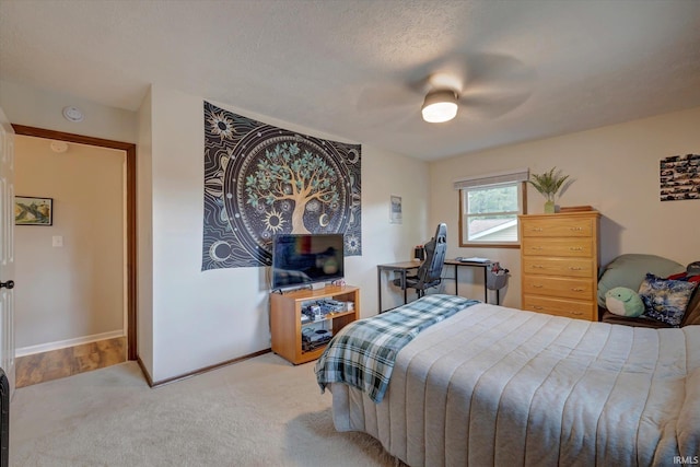 bedroom featuring carpet, ceiling fan, and baseboards