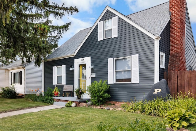 1134 N 14th St, Lafayette, IN 47904 - view of front of house with a chimney and a shingled roof