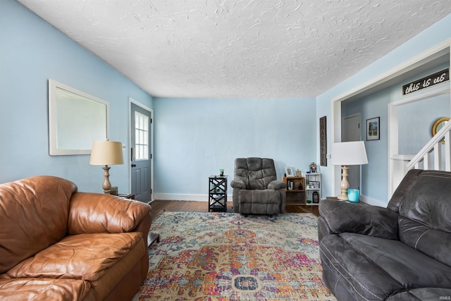 1134 N 14th St, Lafayette, IN 47904 - living area with wood finished floors, baseboards, and a textured ceiling
