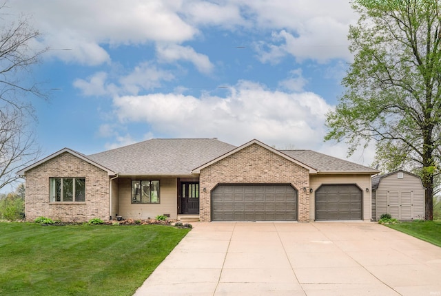 2375 N 110 W, Angola, IN 46703 - ranch-style home with a garage, brick siding, concrete driveway, and a front lawn