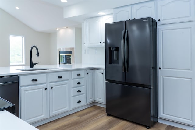 2375 N 110 W, Angola, IN 46703 - kitchen featuring black appliances, a sink, light wood-style floors, white cabinetry, and recessed lighting