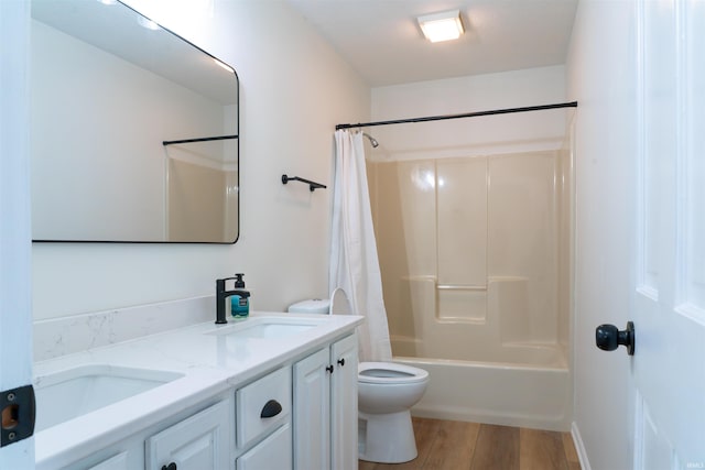 2375 N 110 W, Angola, IN 46703 - full bath with toilet, double vanity, shower / bath combo with shower curtain, and wood finished floors