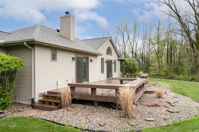 2375 N 110 W, Angola, IN 46703 - rear view of property with a chimney, roof with shingles, a deck, and a yard