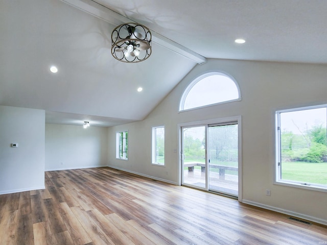 2375 N 110 W, Angola, IN 46703 - unfurnished living room featuring beamed ceiling, high vaulted ceiling, wood finished floors, baseboards, and recessed lighting